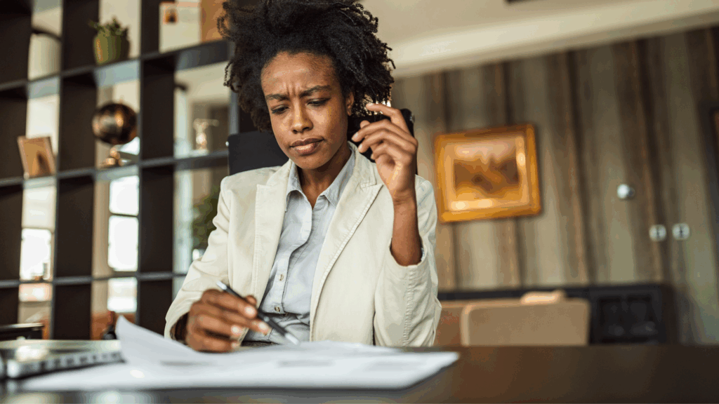 A Black entrepreneur working on her business plan.