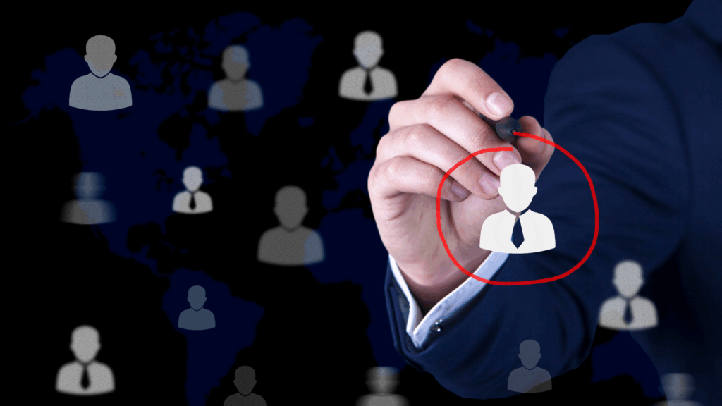 A person circling a graphic of a person amongst other people graphics.